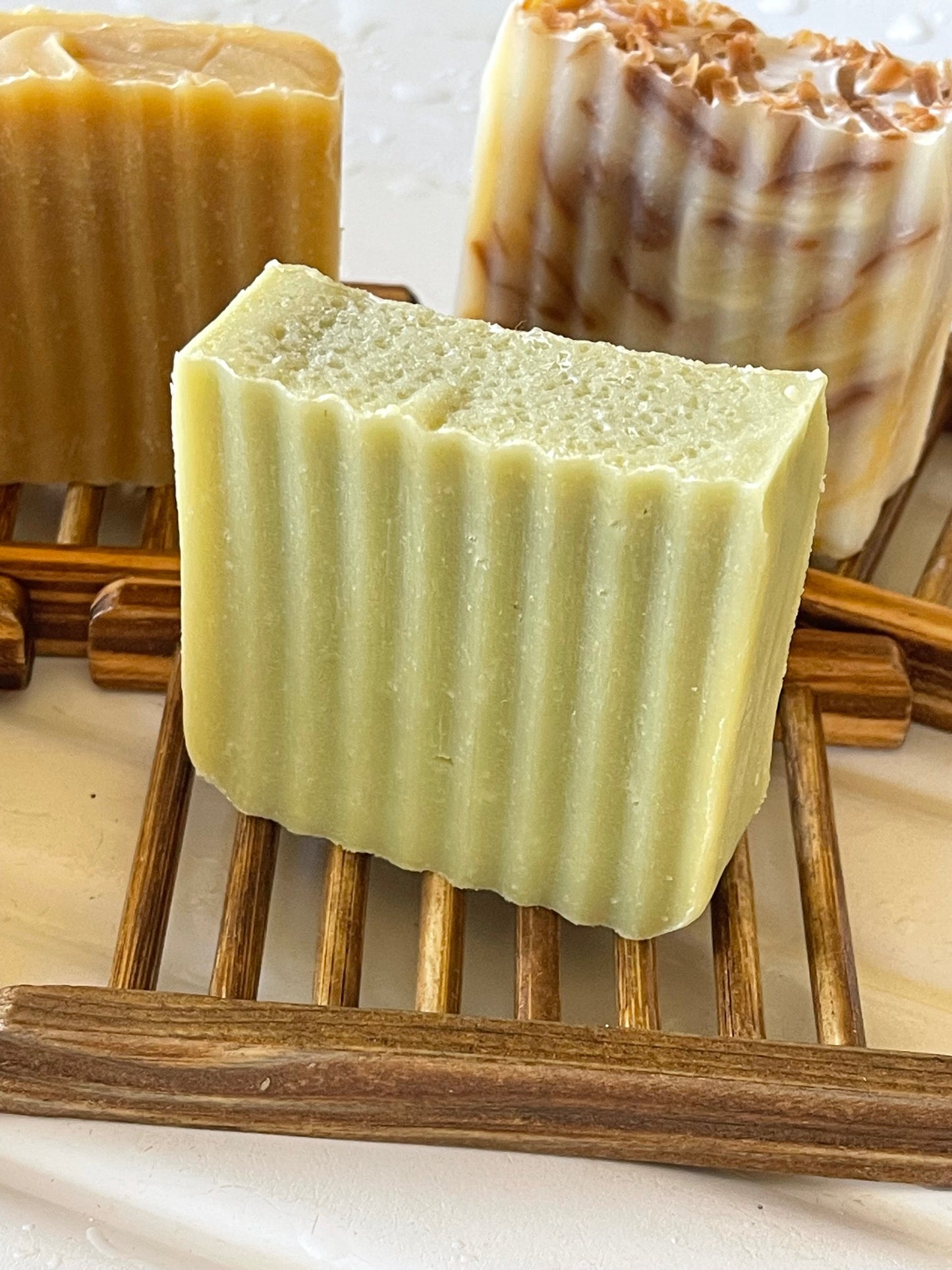 Castille Soap Bar from above on wooden soap dish